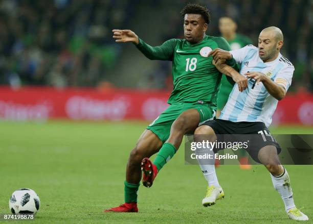 Javier Mascherano of Argentina fights for the ball with Alex Iwobi of Nigeria during an international friendly match between Argentina and Nigeria at...