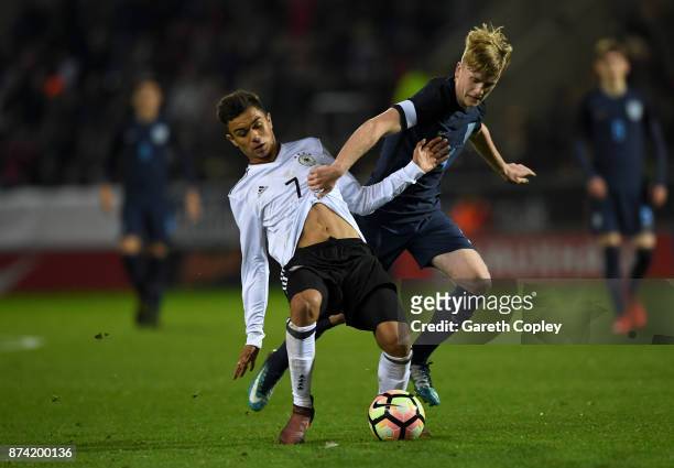 Oliver Batista Meier of Germany is tackled by Thomas Doyle of England during the International Match between England U17 and Germany U17 at The New...