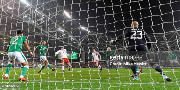 Andreas Christensen of Denmakr shoots and his shot is deflected in by Cyrus Christie of the Republic of Ireland for a own goal and Denmark's first...
