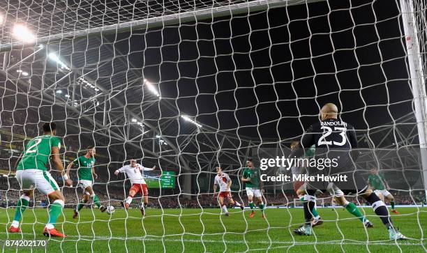 Andreas Christensen of Denmakr shoots and his shot is deflected in by Cyrus Christie of the Republic of Ireland for a own goal and Denmark's first...