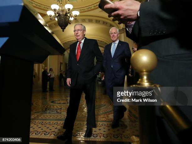 Senate Majority Leader Mitch McConnell ,, and Sen. John Cornyn , walk up to speak to reporters about the proposed Senate Republican tax bill, after...