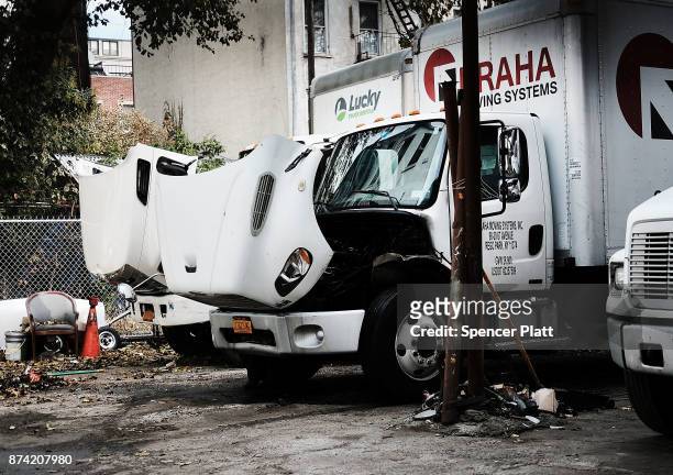 Trucks waiting for repair sit behind a mechanic's shop on November 14, 2017 in New York City. According to a new report by the International Energy...