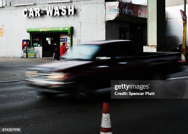 Truck drives by a car wash on November 14, 2017 in New York City. According to a new report by the International Energy Agency, global oil demand...