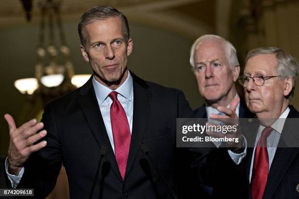 Senator John Thune, a Republican from South Dakota, speaks as Senate Majority Leader Mitch McConnell, a Republican from Kentucky, right, and Senate...