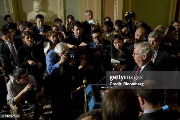 Senate Majority Leader Mitch McConnell, a Republican from Kentucky, right, speaks during a news conference after a weekly GOP luncheon meeting at the...