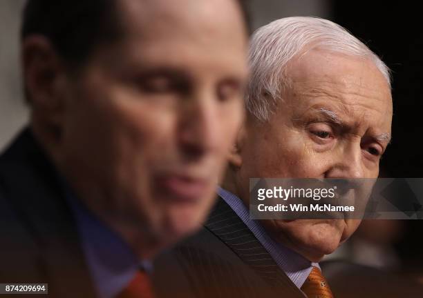Committee chairman Sen. Orrin Hatch listens as Sen. Ron Wyden, ranking member of the Senate Finance Committee, speaks during a markup of the...