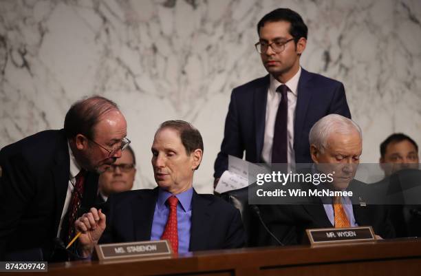 Committee chairman Sen. Orrin Hatch and ranking member Sen. Ron Wyden confer with aides during a markup of the Republican tax reform proposal...