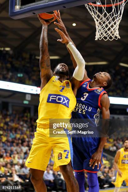 Deandre Kane, #7 of Maccabi Fox Tel Aviv competes with Errick McCollum, #3 of Anadolu Efes Istanbul during the 2017/2018 Turkish Airlines EuroLeague...