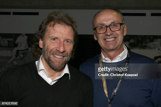 Wolfgang Rolff and Juergen Kohler pose during the Club Of Former National Players Meeting at RheinEnergieStadion on November 14, 2017 in Cologne,...