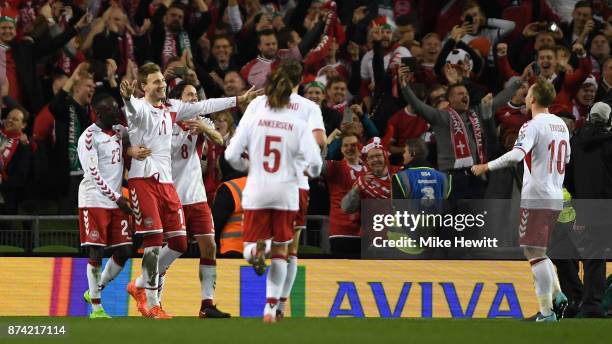 Nicklas Bendtner of Denmark celebrates scoring his sides fifth goal with his Denmark team mates during the FIFA 2018 World Cup Qualifier Play-Off:...