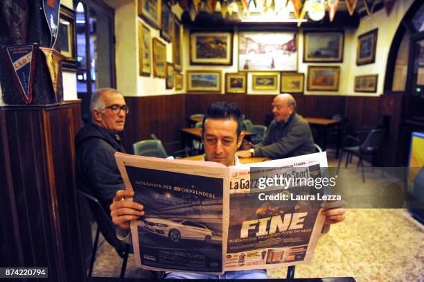 Man reads Italian newspaper showing Italy soccer team defeat the day after Italy failed to qualify for the World Cup 2018 in the famous Bar Civili on...