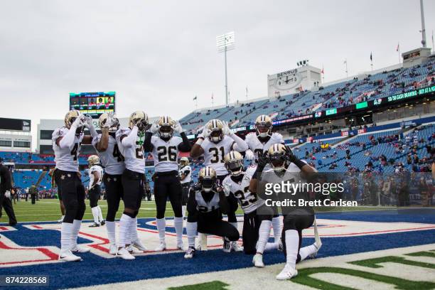 New Orleans Saints players pose for a photograph without cause before the game against the Buffalo Bills at New Era Field on November 12, 2017 in...