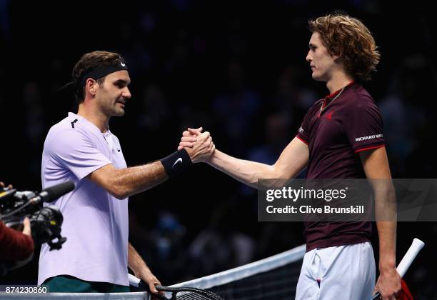 Alexander Zverev of Germany congratulates Roger Federer of Switzerland on victory follwing their singles match on day three of the Nitto ATP World...