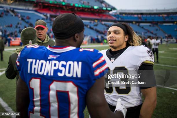Trey Edmunds of the New Orleans Saints speaks with Deonte Thompson of the Buffalo Bills after the game at New Era Field on November 12, 2017 in...