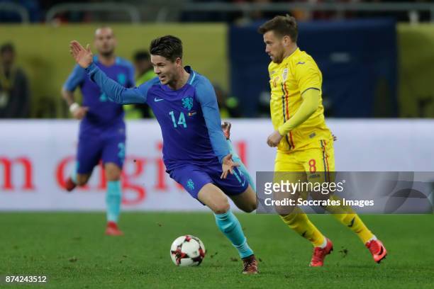 Marco van Ginkel of Holland, Mihai Pintilii of Romania during the International Friendly match between Romania v Holland at the Arena Nationala on...