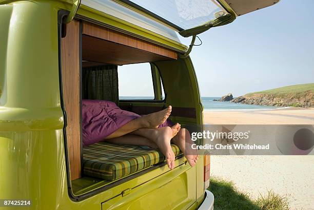 couple lying in camper van - comportamento sessuale umano foto e immagini stock