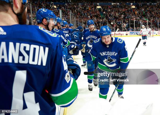 Derek Dorsett of the Vancouver Canucks is congratulated by teammates after scoring during their NHL game against the Washington Capitals at Rogers...