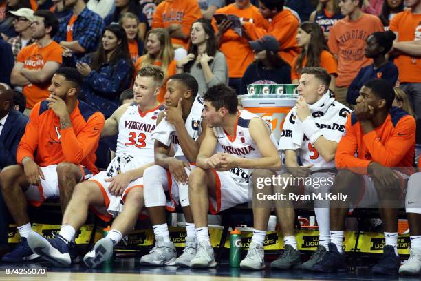 Virginia Cavaliers players laugh from the bench in the second half during a game against the Austin Peay Governors at John Paul Jones Arena on...