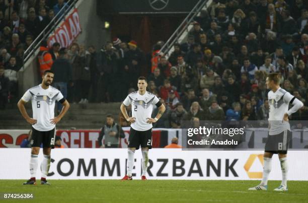 Sami Khedira , Niklas Sule and Toni Kroos of Germany react during the international friendly soccer match between Germany and France at Rhein-Energie...