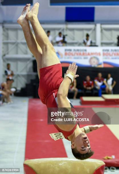 Guatemalan gymnast Jorge Vega performs on the vault in the artistic gymnastics men's individual event, during the XVIII Bolivarian Games 2017 in...