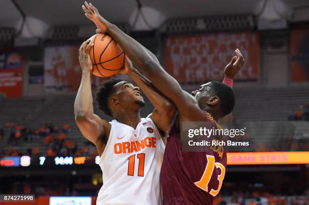 Edogi of the Iona Gaels blocks the shot of Oshae Brissett of the Syracuse Orange during the first half at the Carrier Dome on November 14, 2017 in...