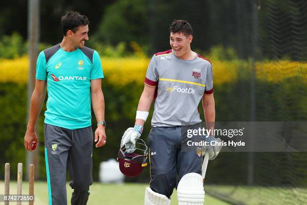 Mitchell Starc and Matthew Renshaw talk in the nets during an Australian cricket training session at Allan Border Field on November 15, 2017 in...