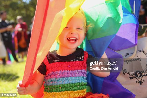 Frenchie Thomson looks out from her rainbow flag towards her grandmother on November 15, 2017 in Sydney, Australia. Australians have voted for...