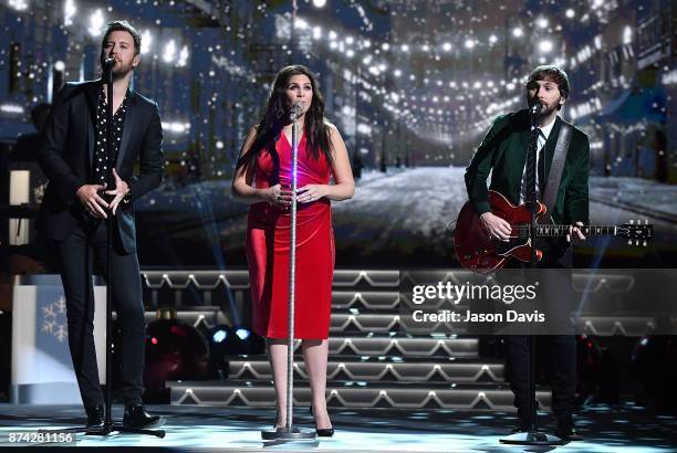 Recording Artists Charles Kelley,Hillary Scott and Dave Haywood of Lady Antebellum performs on stage during 2017 CMA Country Christmas at The Grand...