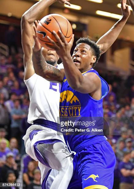Guard Isaiah Ross of the Missouri-Kansas City Kangaroos drives to the basket against the Kansas State Wildcats during the first half on November 14,...