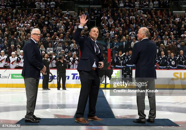 Dale Hawerchuk waves to the crowd before the ceremonial puck drop prior to NHL action between the Jets and the Arizona Coyotes at the Bell MTS Place...