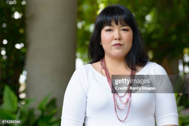 beautiful overweight asian woman getting away from it all with nature - fat asian woman stock pictures, royalty-free photos & images
