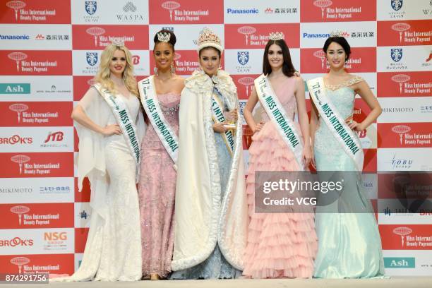 Miss International Miss Indonesia Kevin Lilliana poses with first runner-up Miss Curacao Chanelle Wihelmina Maria , second runner-up Miss Venezuela...