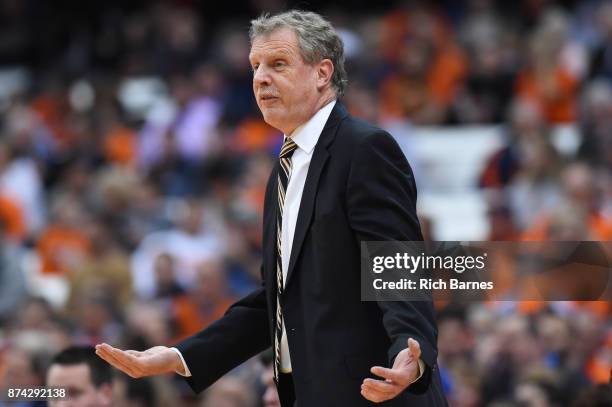 Head coach Tim Cluess of the Iona Gaels reacts to a call against the Syracuse Orange during the first half at the Carrier Dome on November 14, 2017...