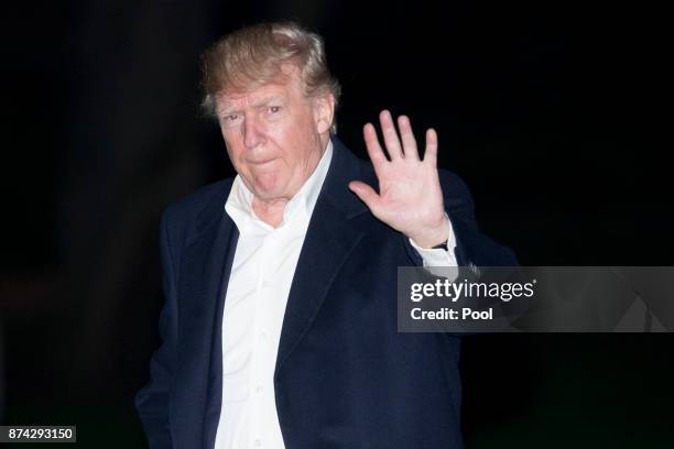 President Donald Trump walks on the South Lawn of the White House after returning from an 11-day Asia trip November 14, 2017 in Washington, D.C....