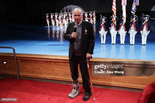 Sen. John McCain speaks after he was presented with the Outstanding Civilian Service Medal during a special Twilight Tattoo performance November 14,...