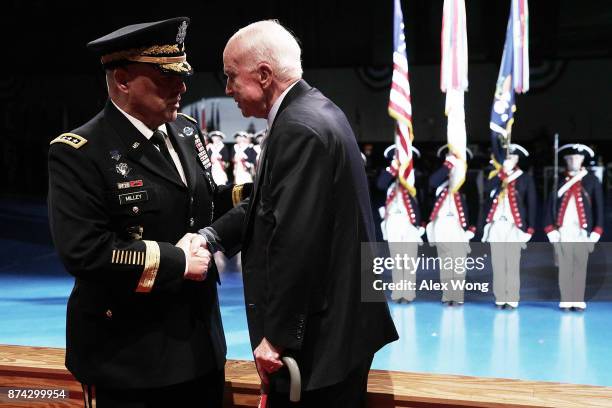 Army Chief of Staff Gen. Mark A. Milley greets Sen. John McCain during a special Twilight Tattoo performance November 14, 2017 at Fort Myer in...