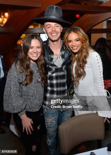 Joy Huerta and Jesse Huerta of Jesse & Joy and Leslie Grace attend the Leading Ladies Lunch during the 18th annual Latin Grammy Awards at Mastro's...