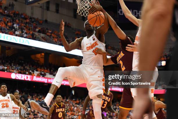 Paschal Chukwu of the Syracuse Orange with the offensive rebound during the second half of play between the Syracuse Orange and Iona Gaels on...