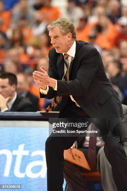 Tim Cluess #Head coach of the Iona Gaels reacts to a shot block by his team during the first half of play between the Syracuse Orange and Iona Gaels...