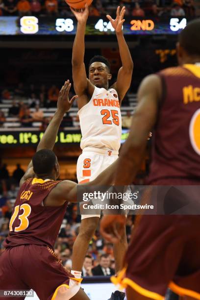 Tyus Battle of the Syracuse Orange shoots a 3 point shot over TK Edogi of the Iona Gaels during the second half of play between the Syracuse Orange...