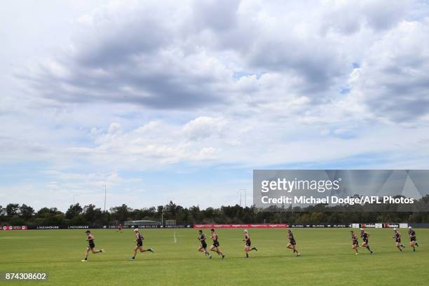 Paddy McCartin of the Saints leads teammates in a sprint around the oval during a St Kilda Saints AFL training session at Linen House Oval on...