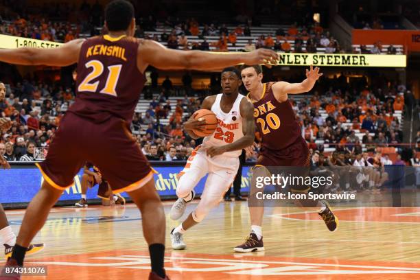 Frank Howard of the Syracuse Orange drives up the center of the court defended by Jan Svandrlik of the Iona Gaels during the second half of play...