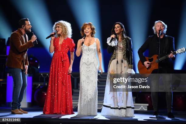 Recording Artists Jimi Westbrook, Kimberly Schlapman, Karen Fairchild and Phillip Sweet of Little Big Town along with Reba McEntire performs on stage...