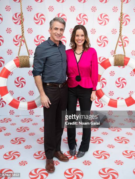 Actors Dermot Mulroney and Ashley Williams attend the opening of Hallmark's Museum of Christmas on November 14, 2017 in New York City.