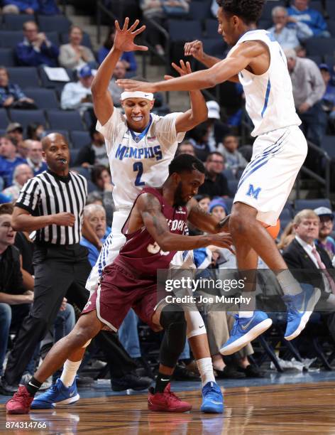 Jimario Rivers and Jamal Johnson of the Memphis Tigers defend against Anthony Black of the Little Rock Trojans on November 14, 2017 at FedExForum in...