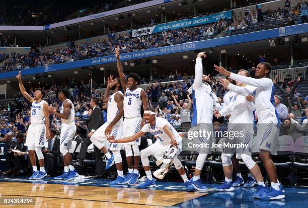 The Memphis Tigers bench celebrates against the Little Rock Trojans on November 14, 2017 at FedExForum in Memphis, Tennessee. Memphis defeated Little...