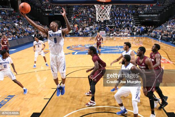 Kyvon Davenport of the Memphis Tigers grabs a rebound against the Little Rock Trojans on November 14, 2017 at FedExForum in Memphis, Tennessee....