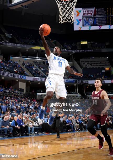 Malik Rhodes of the Memphis Tigers drives to the basket for a layup against the Little Rock Trojans on November 14, 2017 at FedExForum in Memphis,...