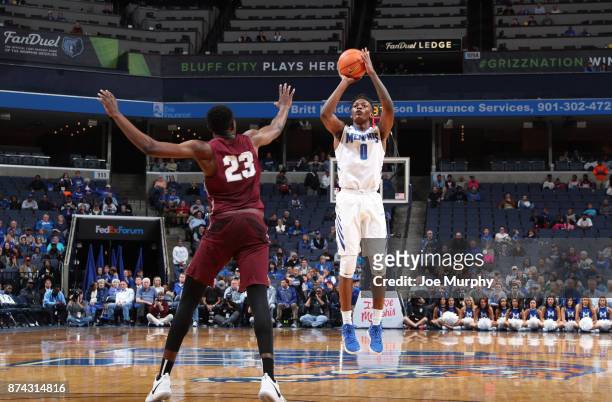 Kyvon Davenport of the Memphis Tigers shoots a jumpshot against Wadley Mompremier of the Little Rock Trojans on November 14, 2017 at FedExForum in...