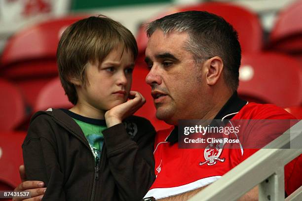 Young Middlesbrough fan and his father react after the final whistle at the Barclays Premier League match between Middlesbrough and Aston Villa at...